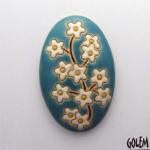 domed oval cabochon with blooming tree