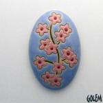 domed oval cabochon with blooming tree