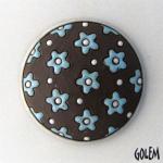 round domed cabochon, blue flowers on dark