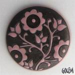large round cabochon, pink on dark clay