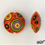 Circles, green/purple on coral, lentil bead size M