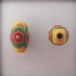 Oval, yellow, red & green design