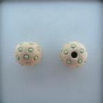 light green dots on offwhite, string of 