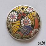 round pendant with snail and flowers