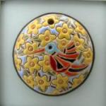 round pendant with humingbird
