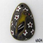 dark oval pendant with yellow bird