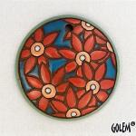 Pale Red flowers on blue, round pendant