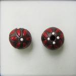 Red leaves on dark clay round bead