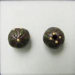 Green leaves on dark clay round bead