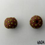 Round Terracotta bead with green polka dots